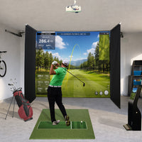 SkyDrop motorized golf simulator enclosure, screen deployed with golfer swinging