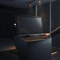 24 inch FHD 24/7 touch monitor mounted on a dark control console with a user operating the touch screen