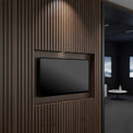 27 inch FHD 24/7 touch monitor wall mounted in a recessed wood slat feature wall